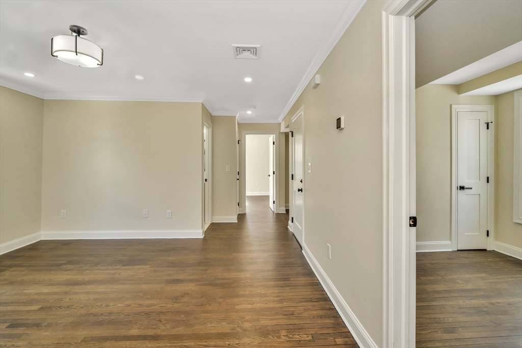 21 Marcella Street, Unit 2 Boston, MA 02119 - Photo 13 of 22 a view of a hallway with wooden floor