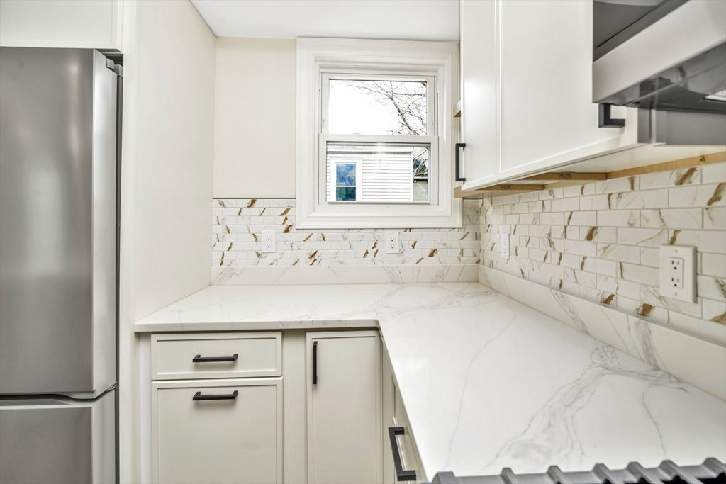 21 Marcella Street, Unit 2 Boston, MA 02119 - Photo 6 of 22 a bathroom with a bathtub and a shower