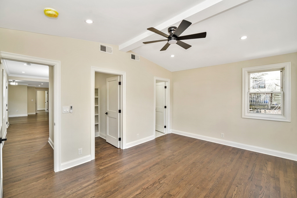 21 Marcella Street, Unit 2 Boston, MA 02119 - Photo 7 of 22 wooden floor in an empty room with a window