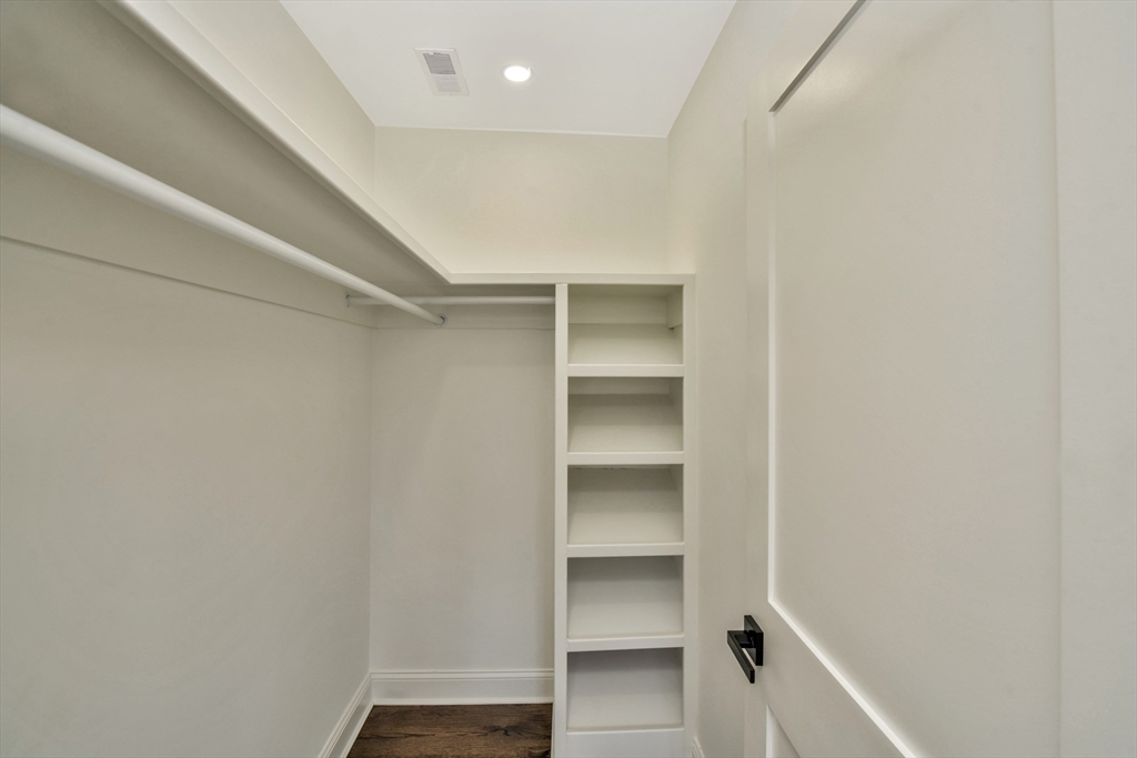 21 Marcella Street, Unit 2 Boston, MA 02119 - Photo 8 of 22 a view of walk in closet with empty racks
