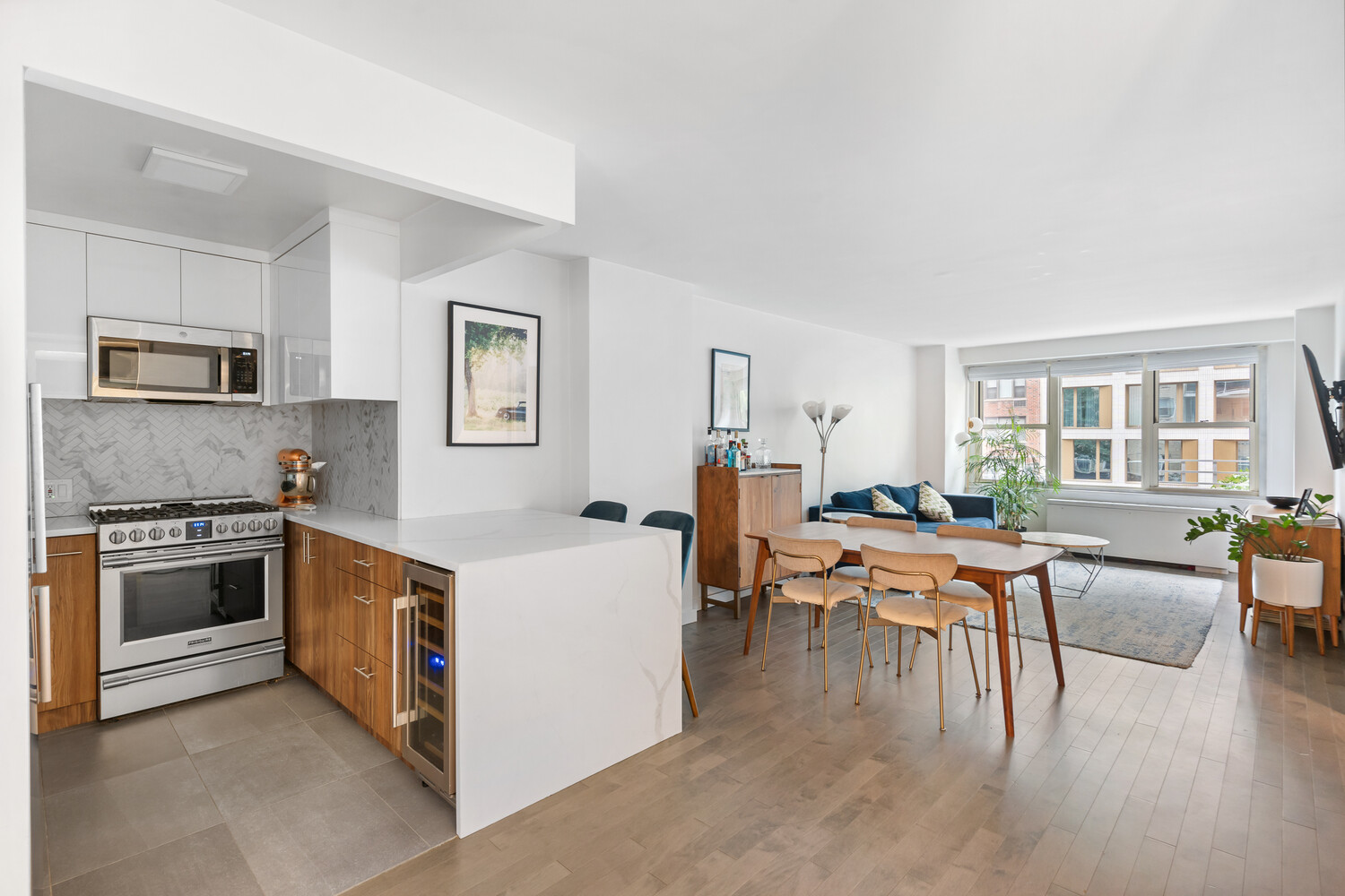 305 East 24th Street, Unit 3B Manhattan, NY 10010 - Photo 2 of 11 a open kitchen with cabinets a stove and a refrigerator