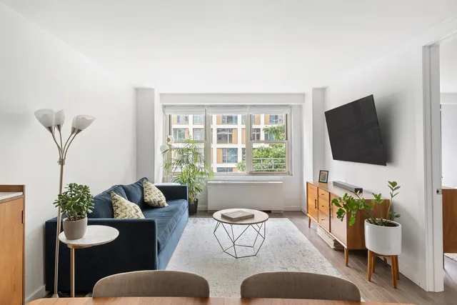 a living room with furniture and a table