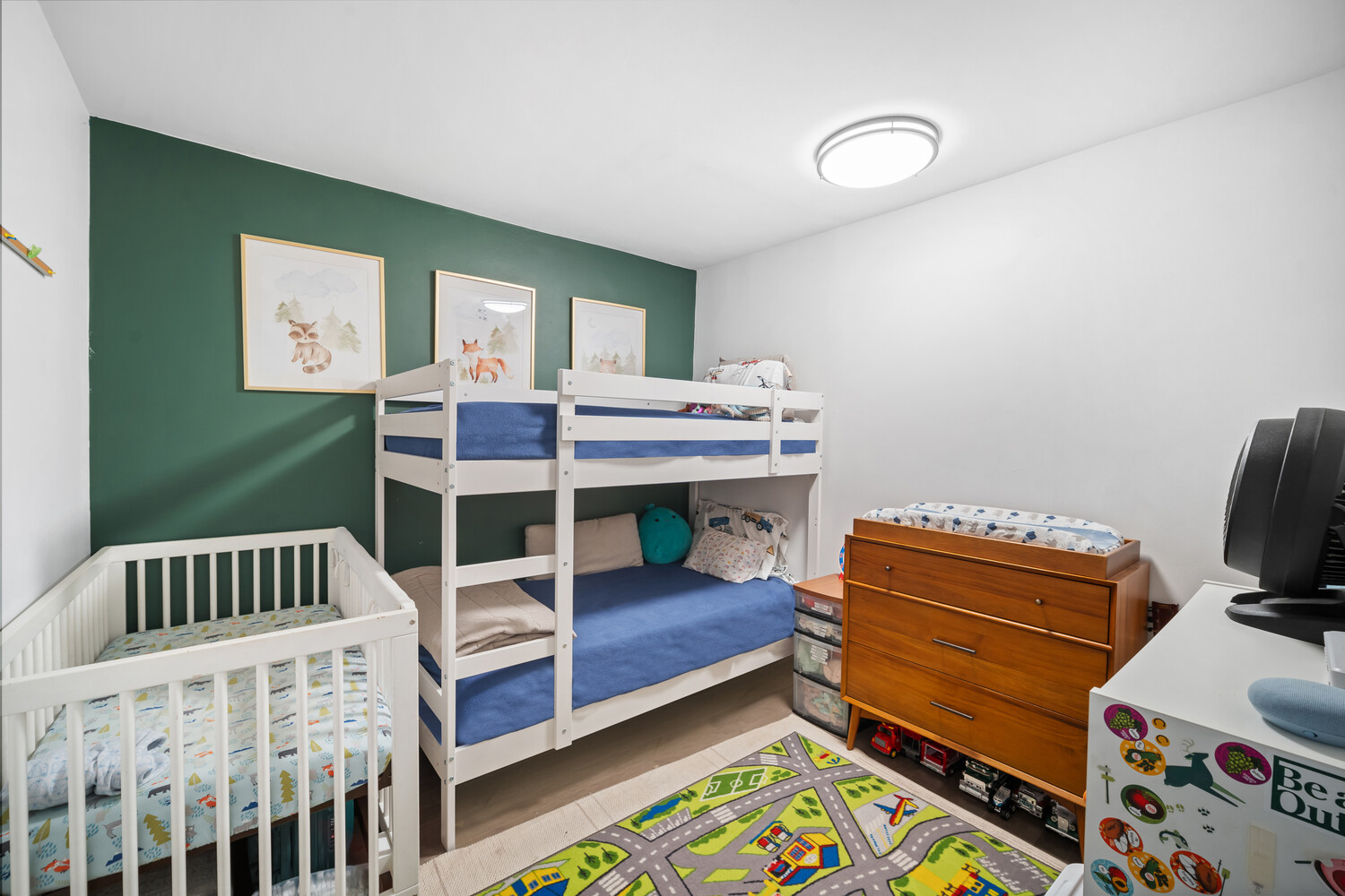 305 East 24th Street, Unit 3B Manhattan, NY 10010 - Photo 8 of 11 a bedroom with furniture and a window