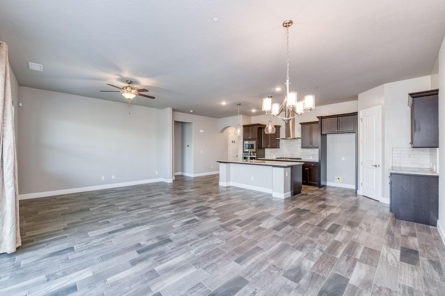 1729 North Carson Avenue Clovis, CA 93619 - Photo 12 of 38 a view of a kitchen with microwave and cabinets