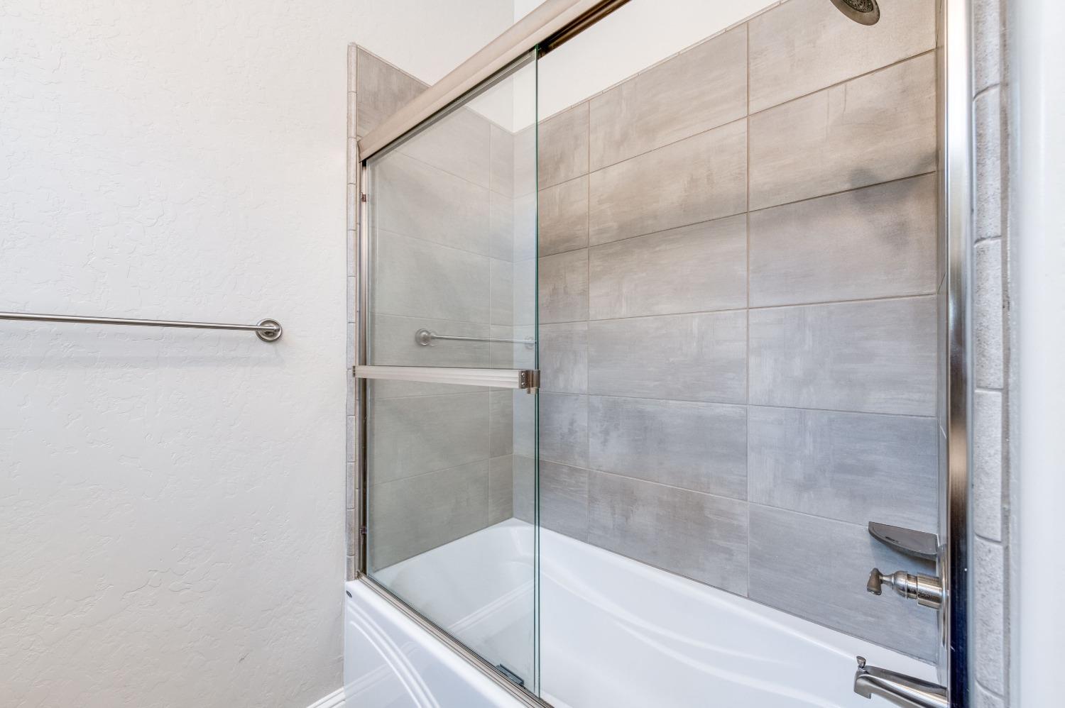 1729 North Carson Avenue Clovis, CA 93619 - Photo 21 of 38 a bathroom with a bathtub
