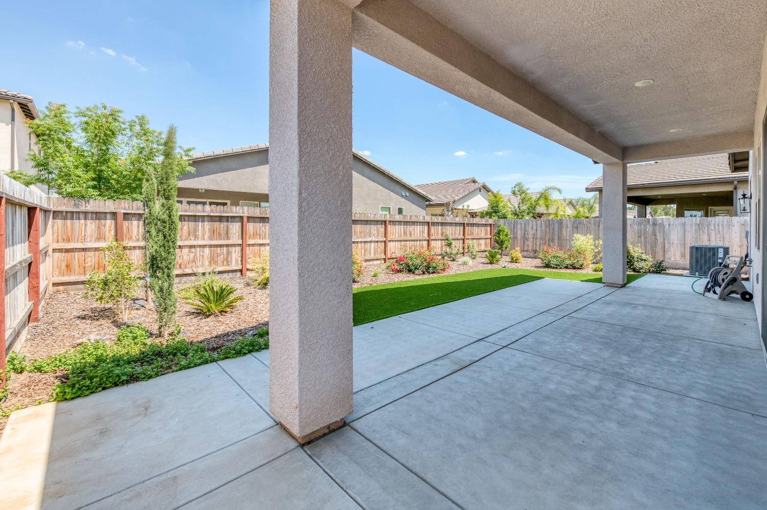 1729 North Carson Avenue Clovis, CA 93619 - Photo 27 of 38 a view of backyard with porch and green space