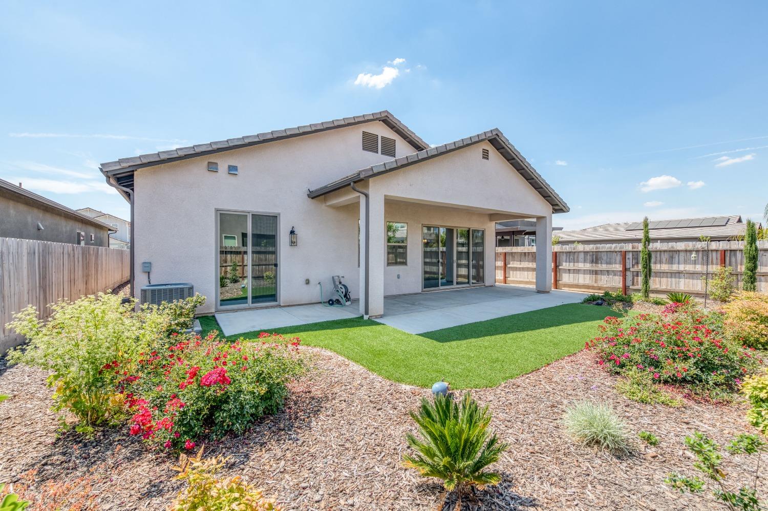 1729 North Carson Avenue Clovis, CA 93619 - Photo 29 of 38 a view of a house with garden