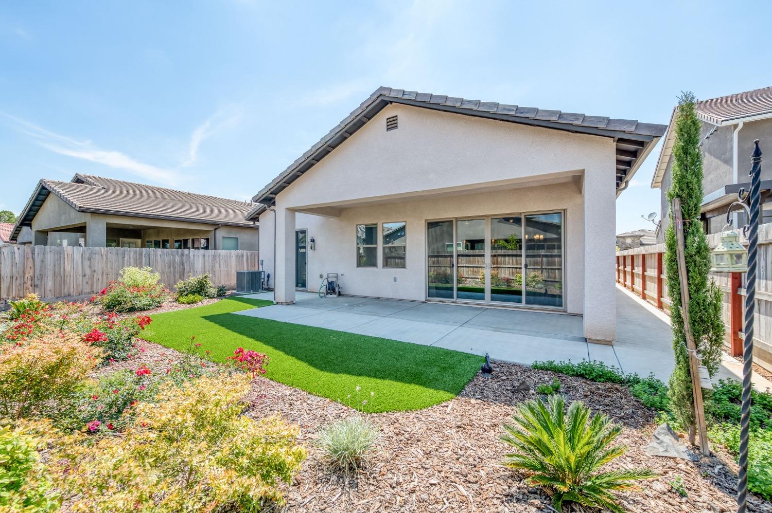 1729 North Carson Avenue Clovis, CA 93619 - Photo 30 of 38 a front view of a house with garden