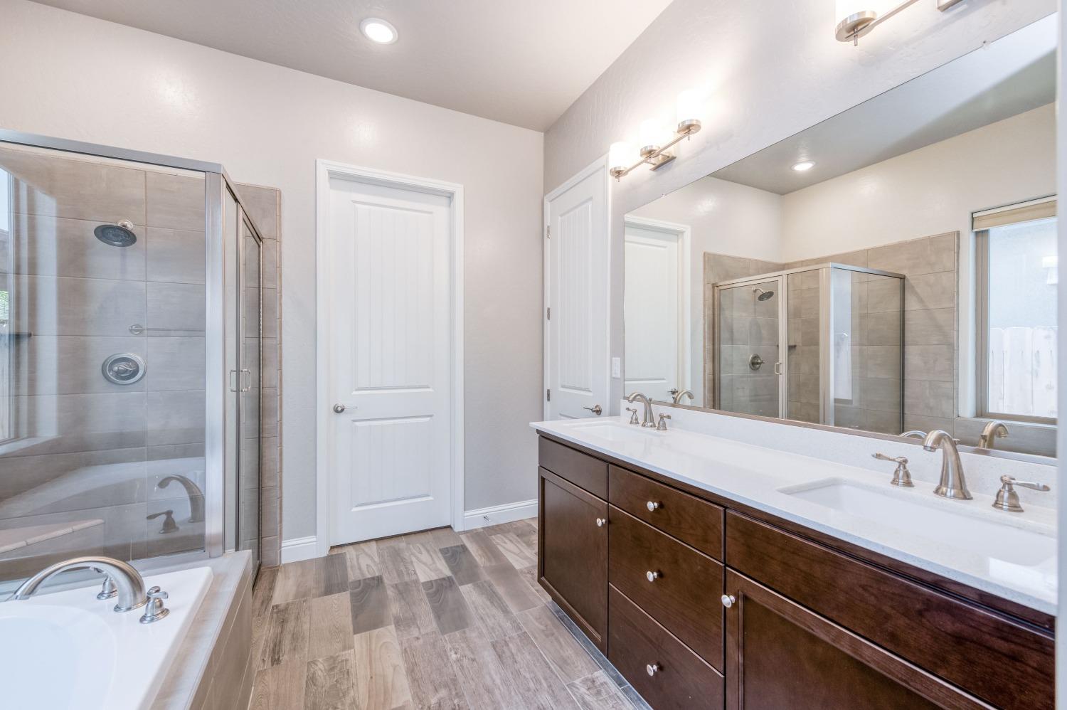 1729 North Carson Avenue Clovis, CA 93619 - Photo 3 of 38 a bathroom with a sink double vanity granite tub and shower