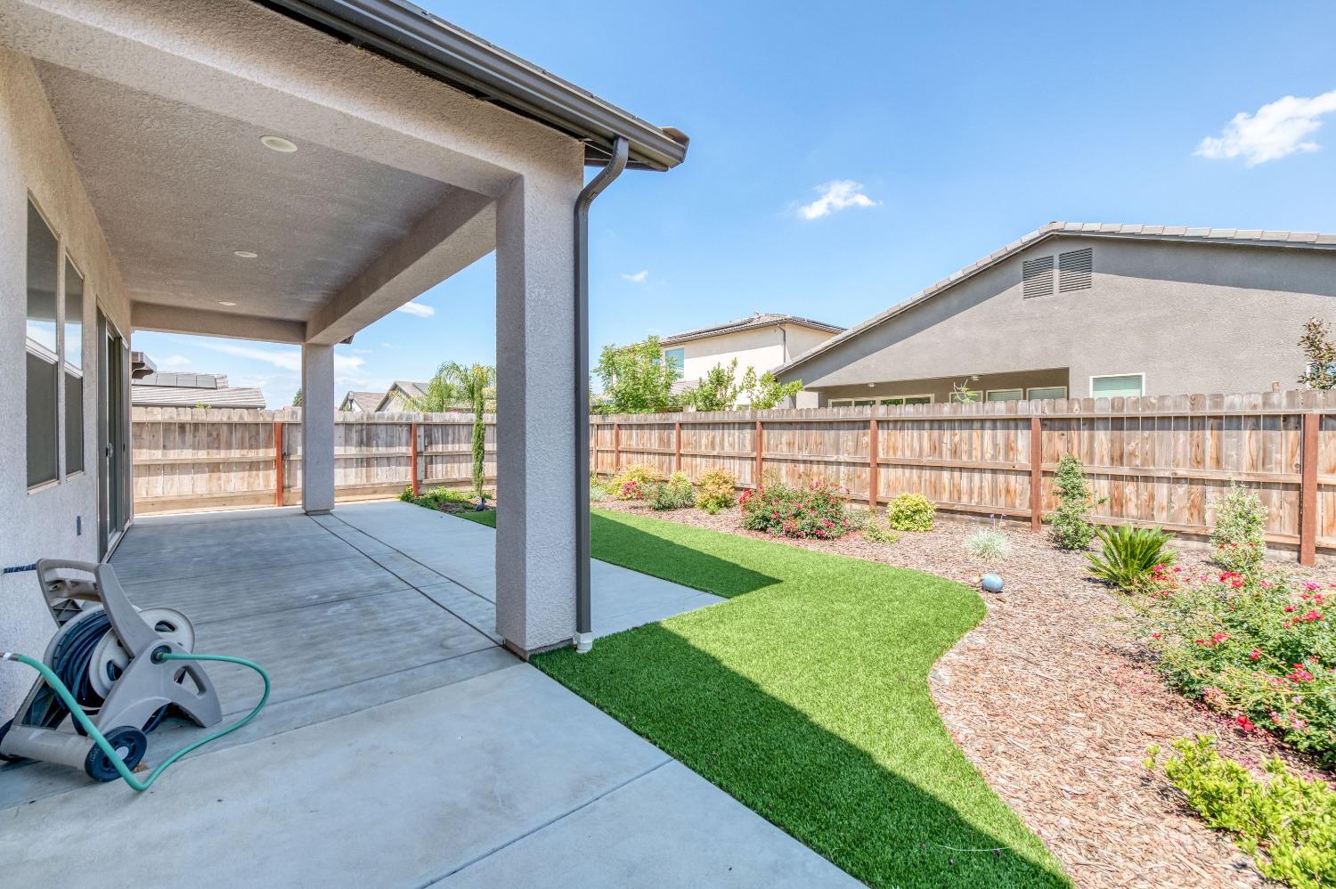 1729 North Carson Avenue Clovis, CA 93619 - Photo 31 of 38 a view of a porch with a garden