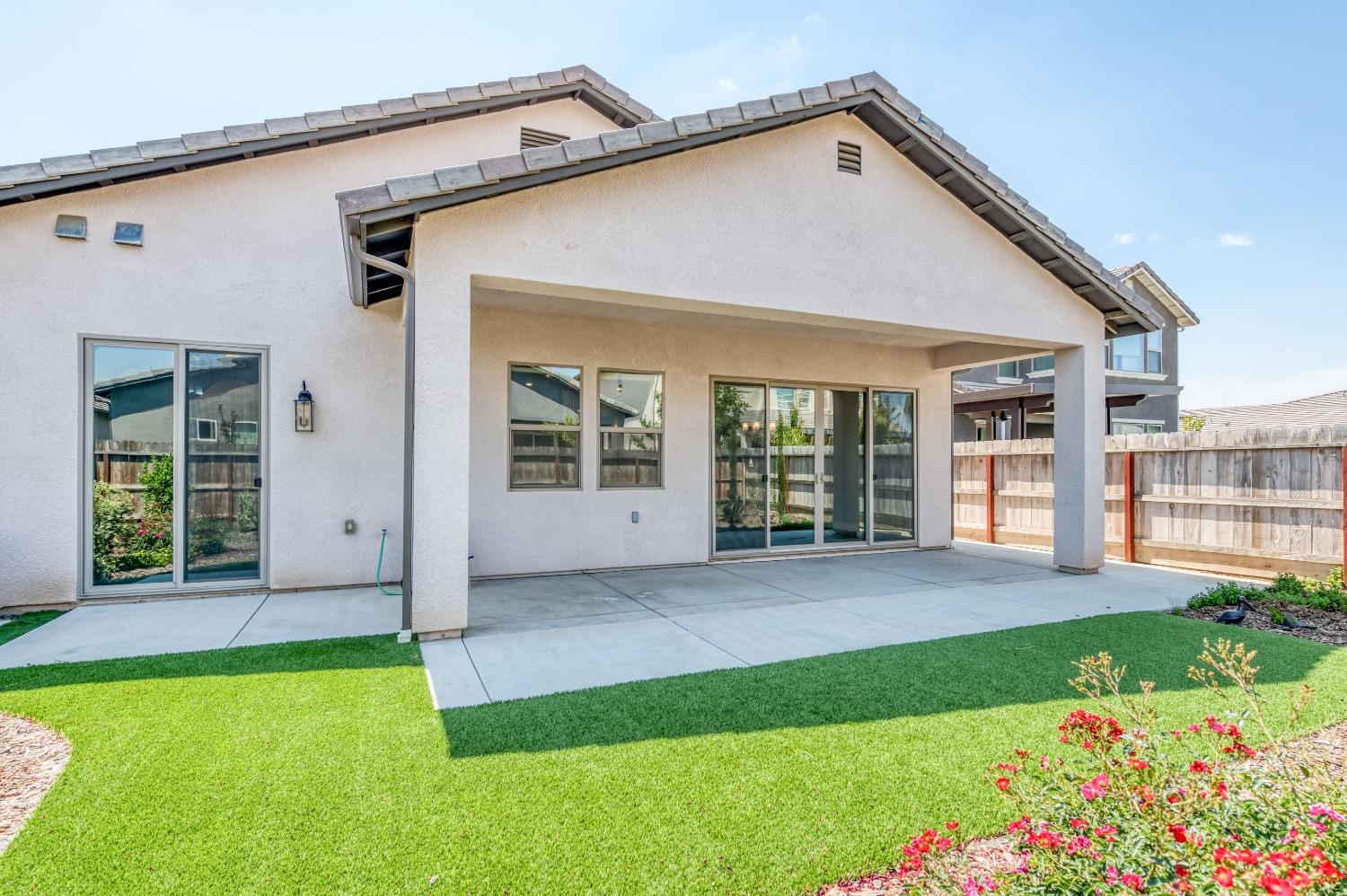 1729 North Carson Avenue Clovis, CA 93619 - Photo 4 of 38 a view of a house with backyard and porch