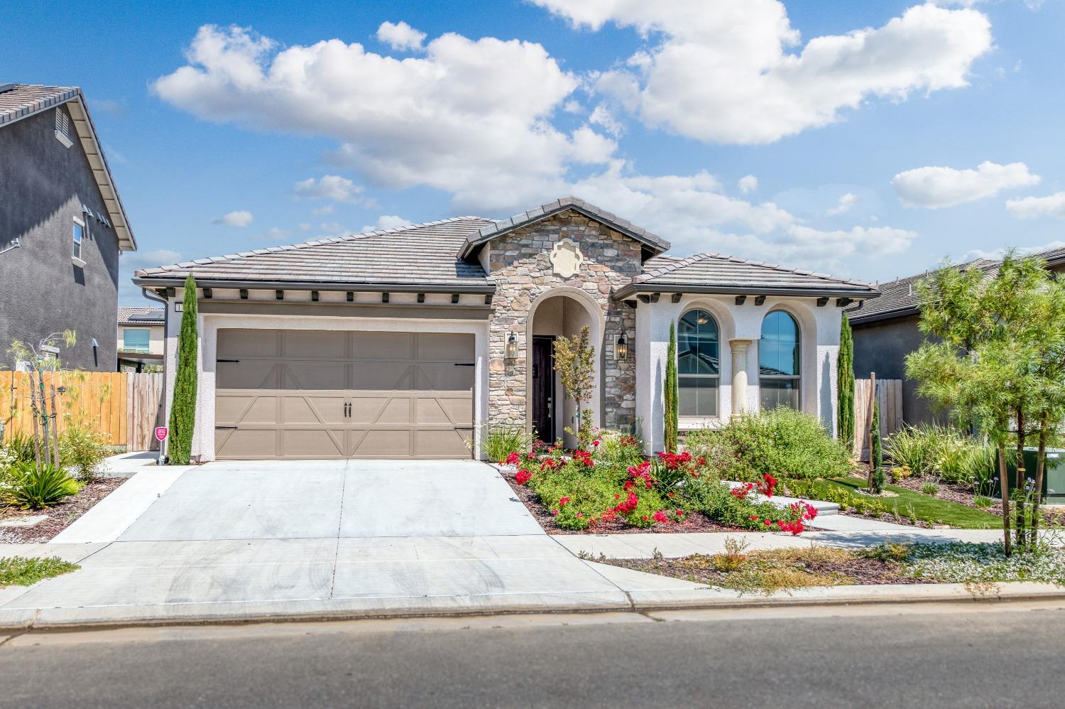 1729 North Carson Avenue Clovis, CA 93619 - Photo 5 of 38 front view of a house with a garden