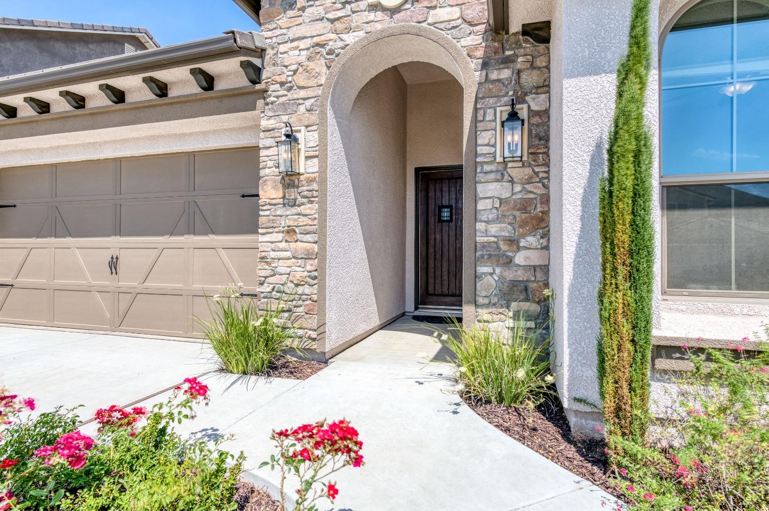 1729 North Carson Avenue Clovis, CA 93619 - Photo 6 of 38 a front view of a house with flowers