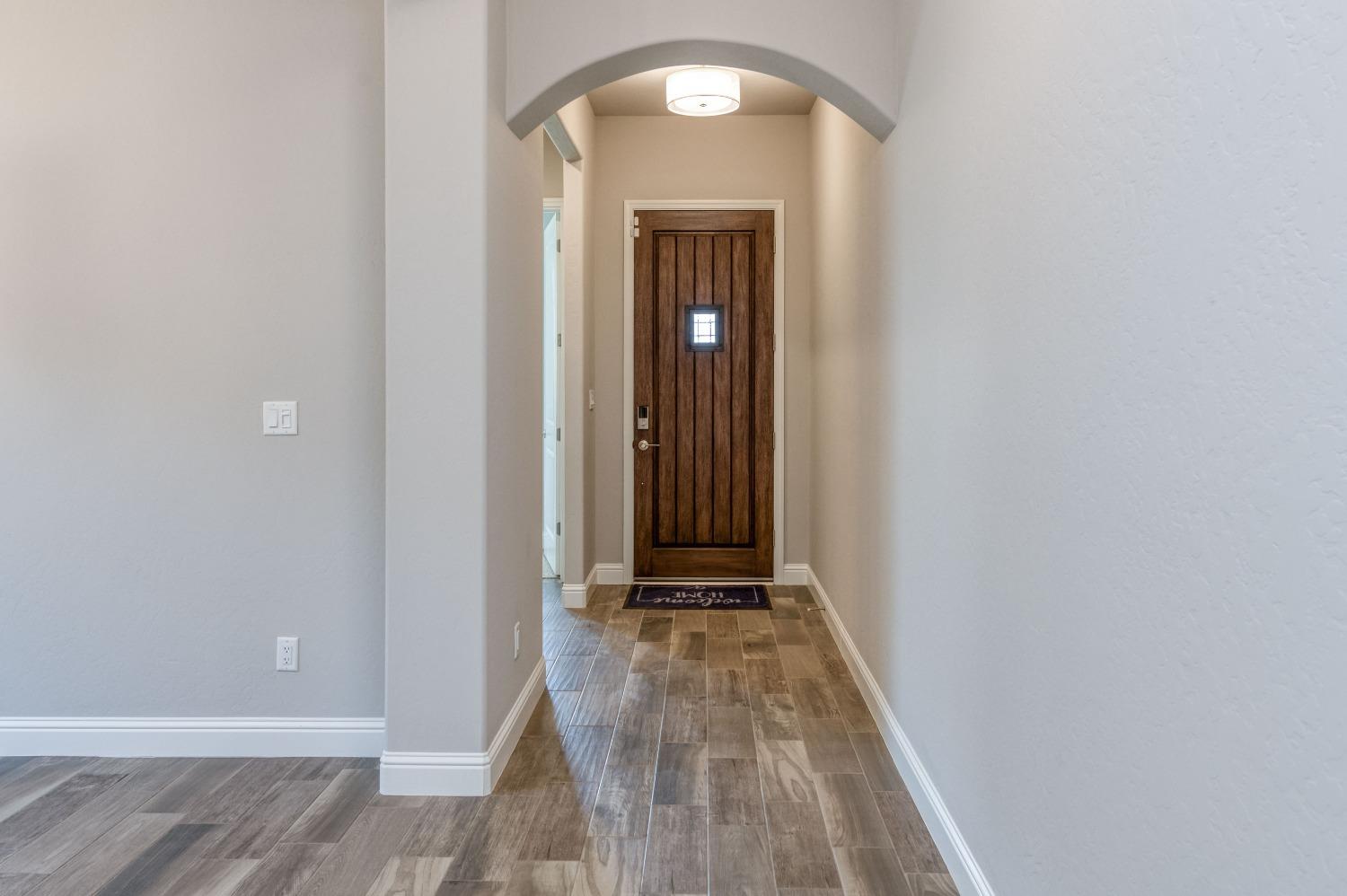 1729 North Carson Avenue Clovis, CA 93619 - Photo 7 of 38 a view of a room with wooden floor