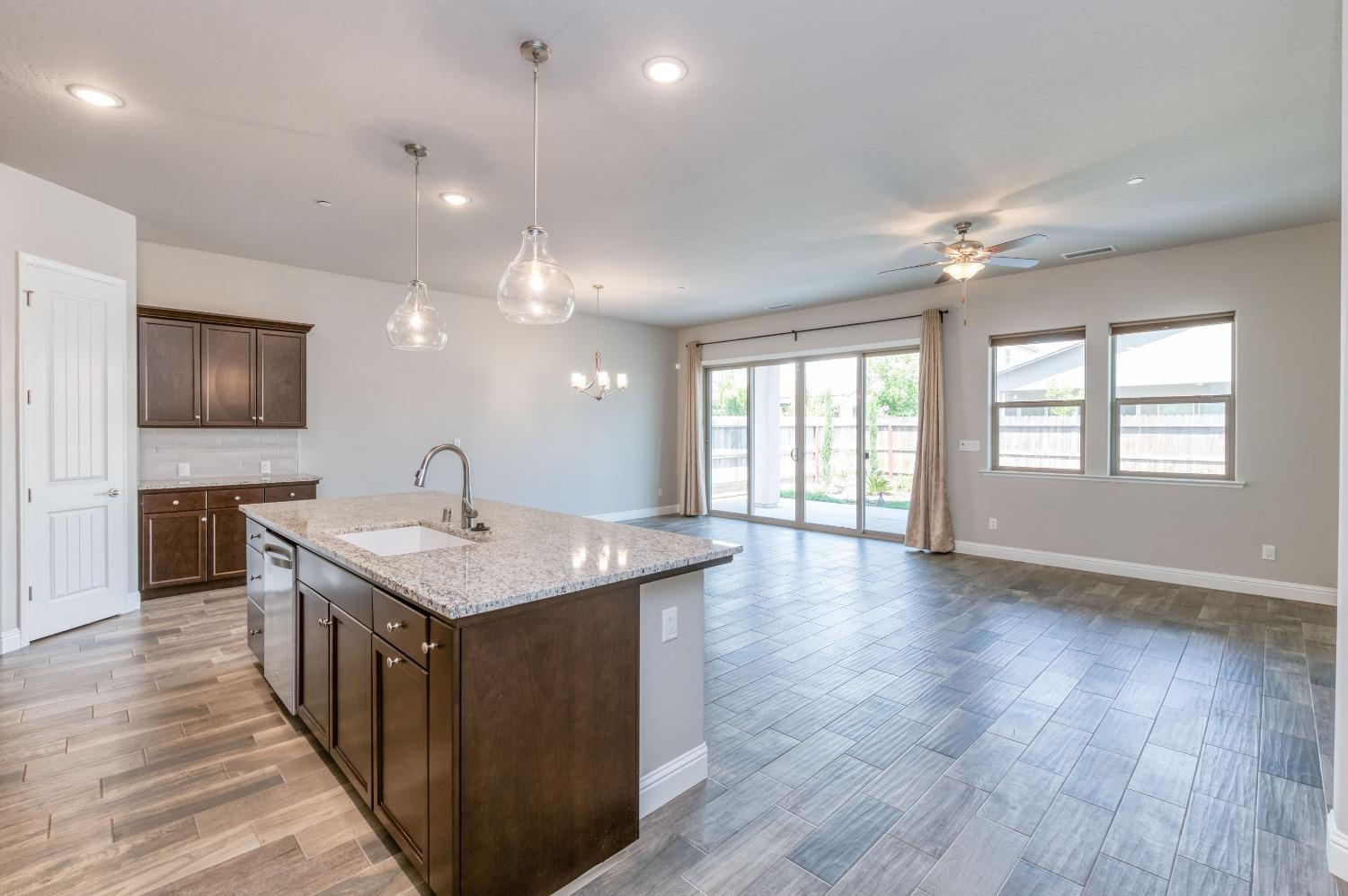 1729 North Carson Avenue Clovis, CA 93619 - Photo 9 of 38 a kitchen with a stove and a sink