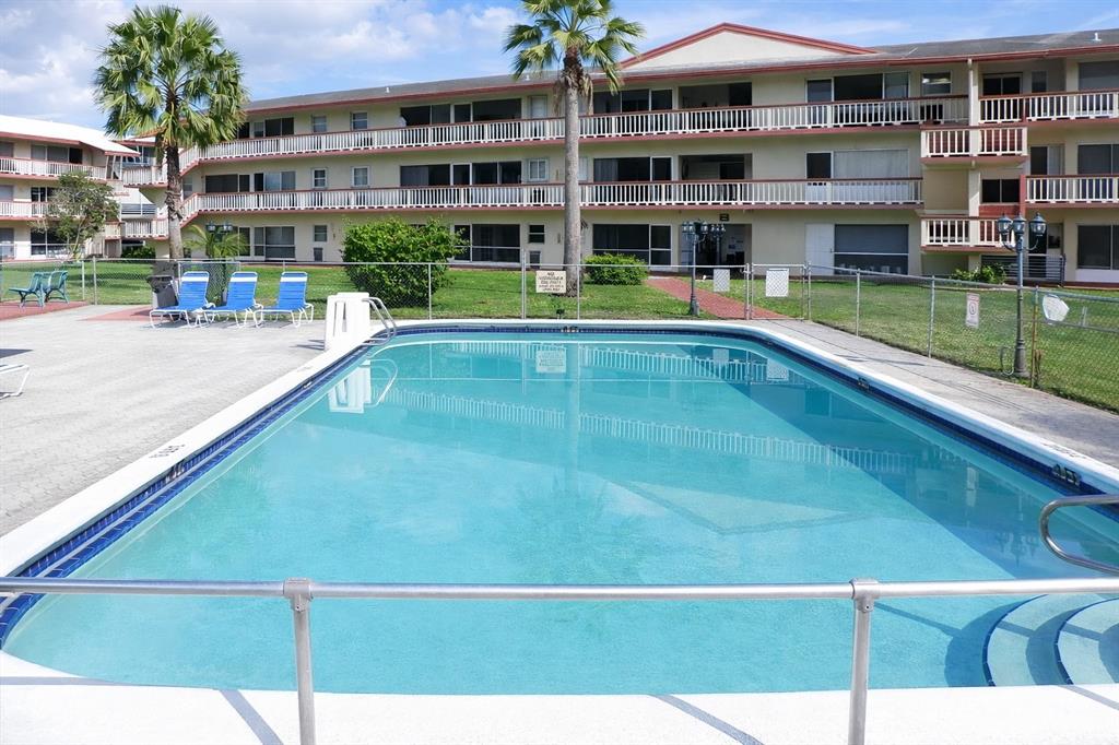 5300 Washington Street, Unit 107D Hollywood, FL 33021 - Photo 1 of 23 a view of swimming pool with outdoor seating
