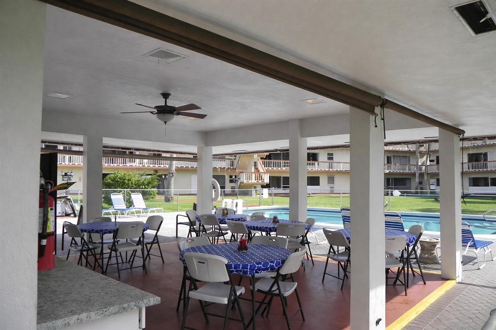 5300 Washington Street, Unit 107D Hollywood, FL 33021 - Photo 17 of 23 a view of a dining room with furniture window and outside view