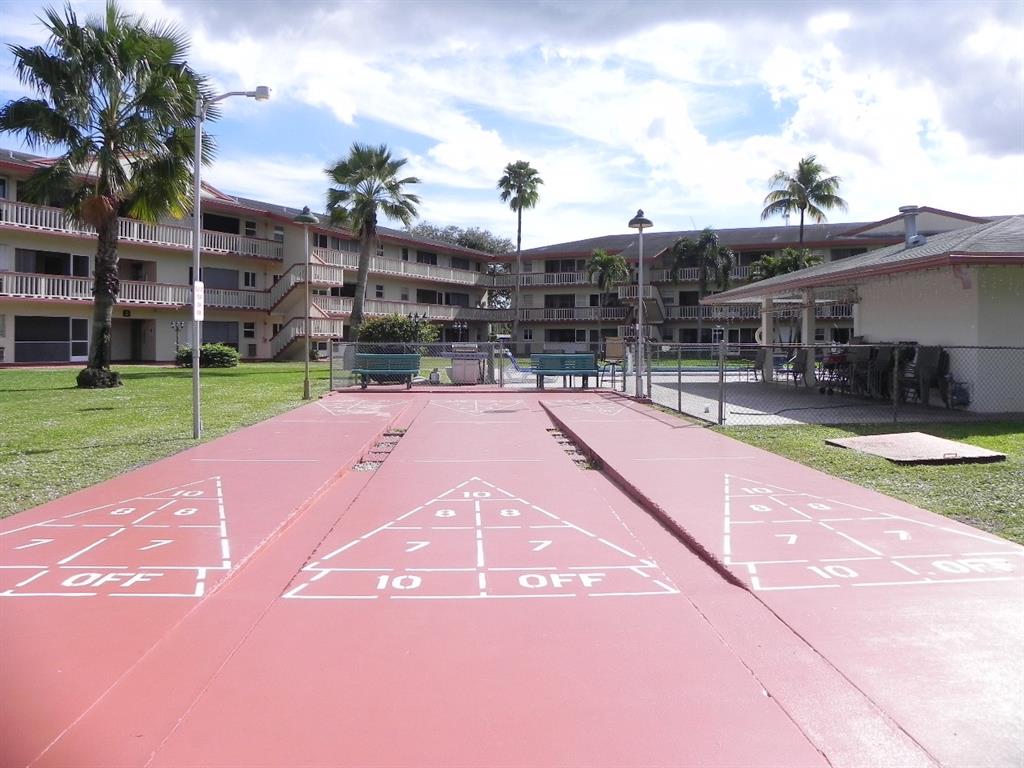 5300 Washington Street, Unit 107D Hollywood, FL 33021 - Photo 20 of 23 a view of a backyard with a patio
