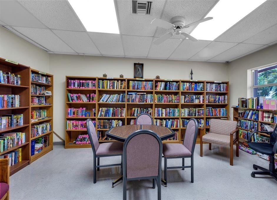 5300 Washington Street, Unit 107D Hollywood, FL 33021 - Photo 23 of 23 a view of a livingroom with furniture and a bookshelf