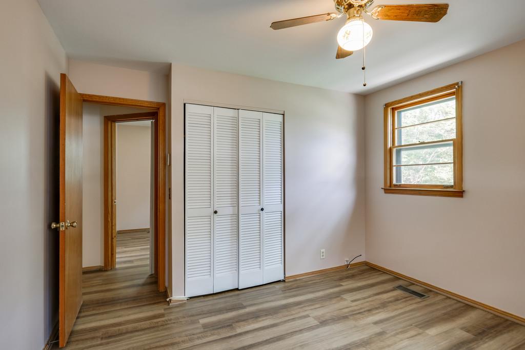851 Reeves Road Antioch, TN 37013 - Photo 14 of 25 a view of an empty room with wooden floor and a window