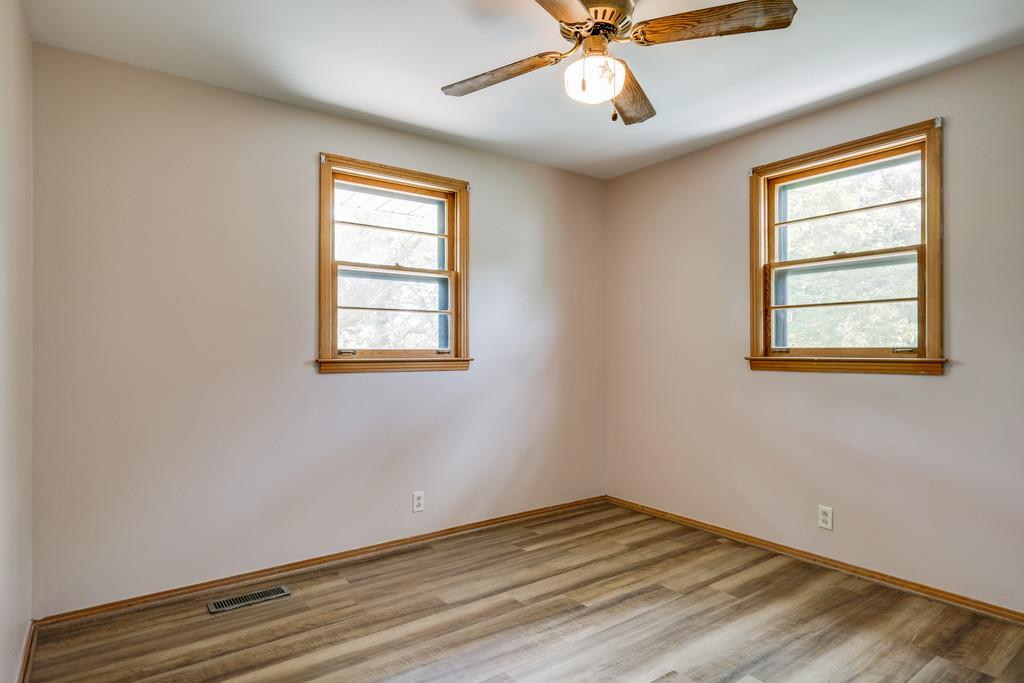 851 Reeves Road Antioch, TN 37013 - Photo 16 of 25 a view of empty room with wooden floor and fan