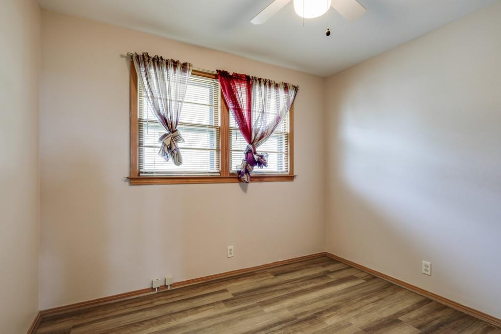 851 Reeves Road Antioch, TN 37013 - Photo 17 of 25 an empty room with wooden floor and windows