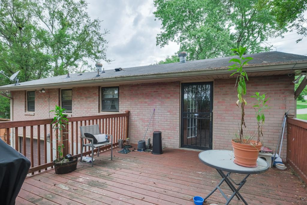 851 Reeves Road Antioch, TN 37013 - Photo 22 of 25 a view of house with wooden floor outdoor seating and yard in back