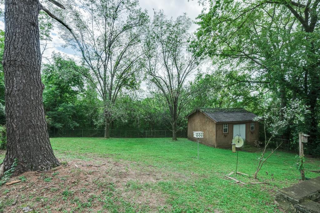 851 Reeves Road Antioch, TN 37013 - Photo 25 of 25 a view of a house with backyard and a tree