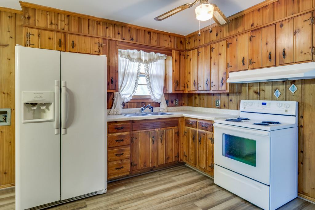 851 Reeves Road Antioch, TN 37013 - Photo 9 of 25 a kitchen with stainless steel appliances a refrigerator sink and cabinets