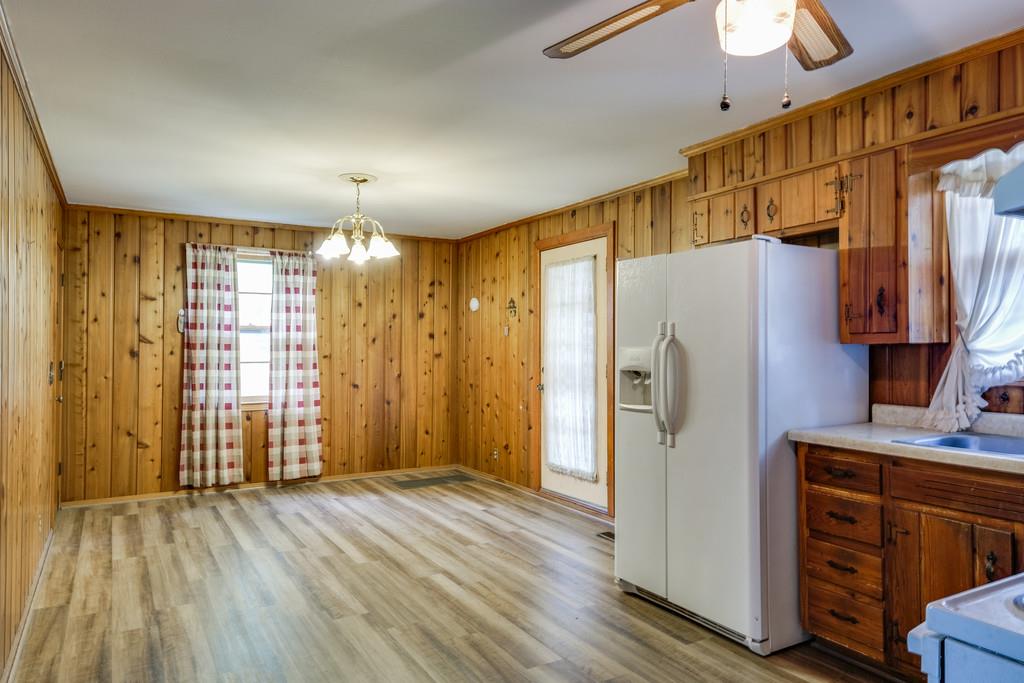 851 Reeves Road Antioch, TN 37013 - Photo 10 of 25 a view of a refrigerator in kitchen and wooden floor