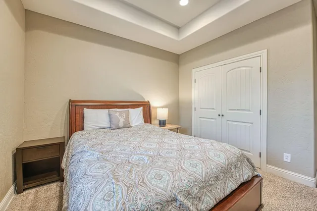 a bathroom with a granite countertop sink a mirror and a shower