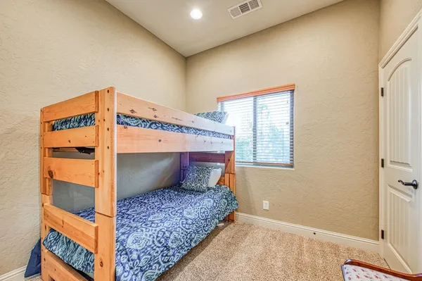a bedroom with furniture and a fireplace