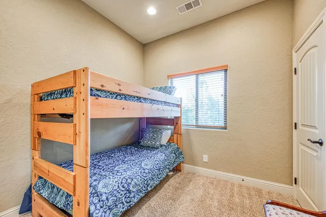 a bedroom with furniture and a fireplace