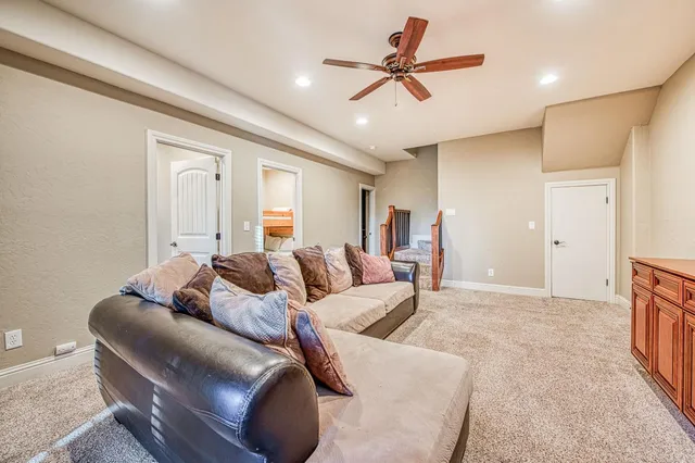 a bedroom with a large bed and a large window