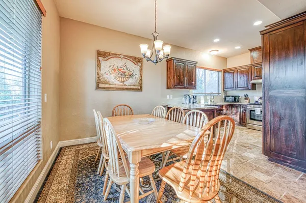 a very nice looking dining room with furniture
