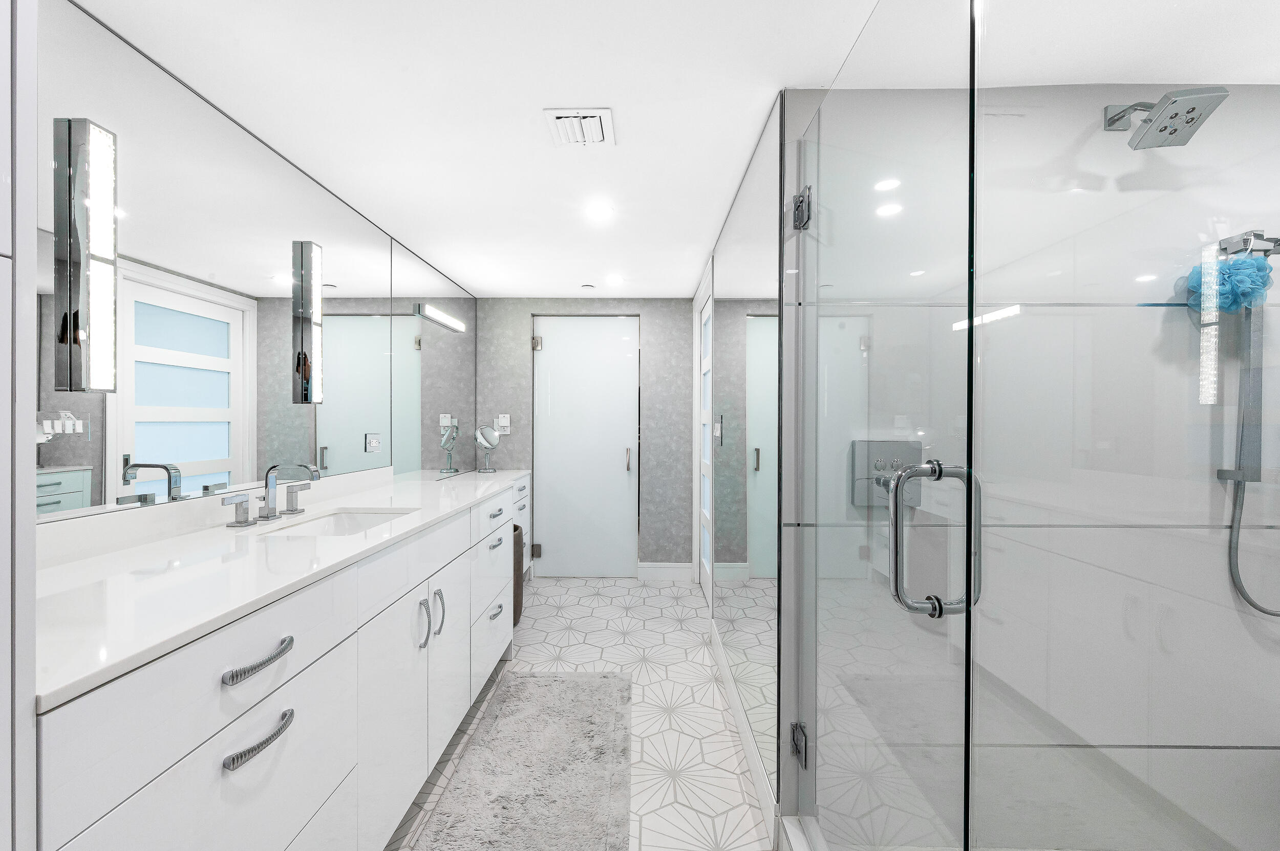 100 Southeast 5th Avenue, Unit 302 Boca Raton, FL 33432 - Photo 16 of 50 a spacious bathroom with a shower sink and mirror