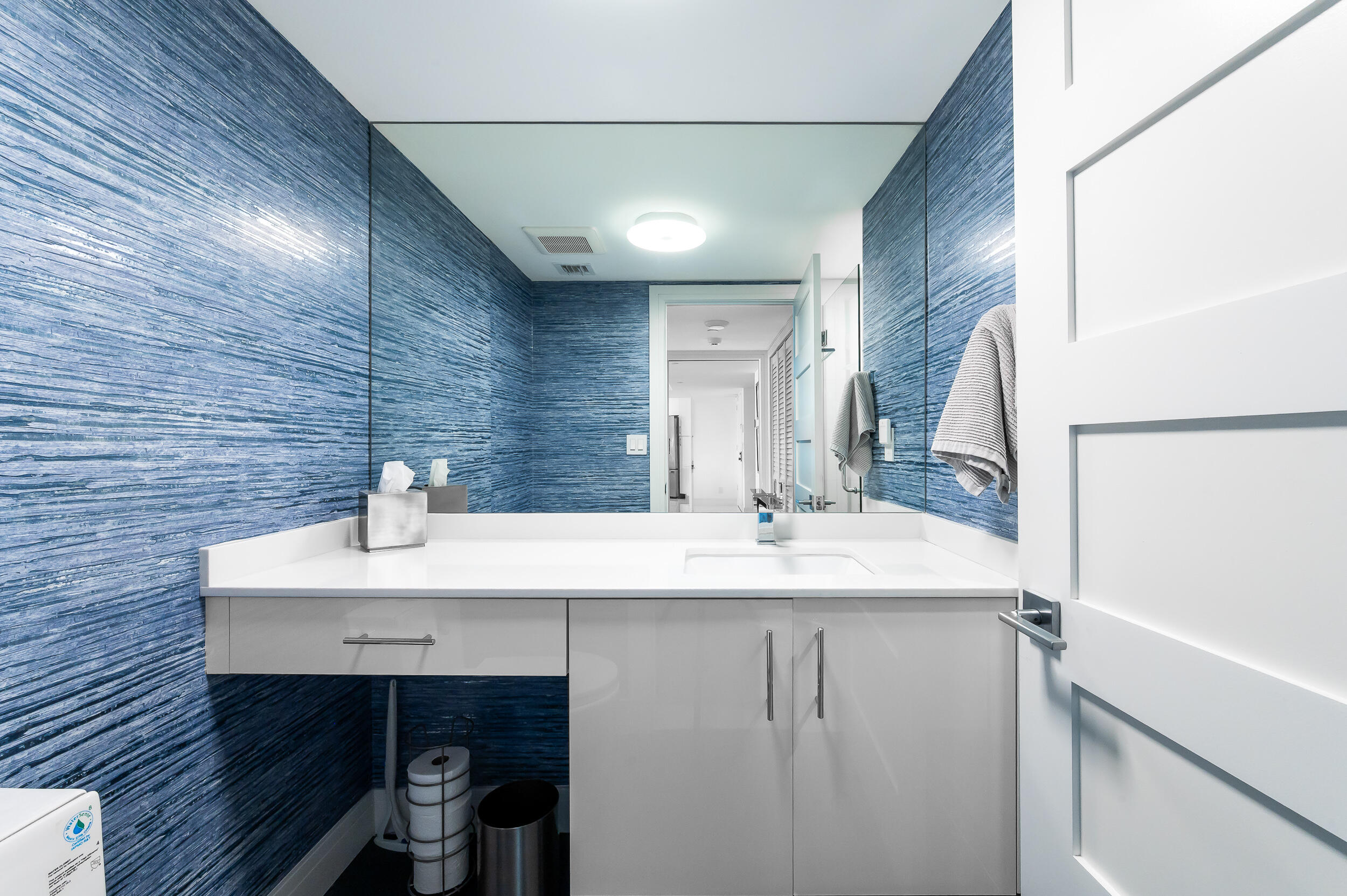 100 Southeast 5th Avenue, Unit 302 Boca Raton, FL 33432 - Photo 19 of 50 a bathroom with a sink and a mirror