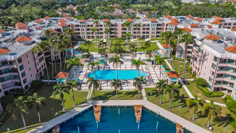 a view of swimming pool with outdoor seating