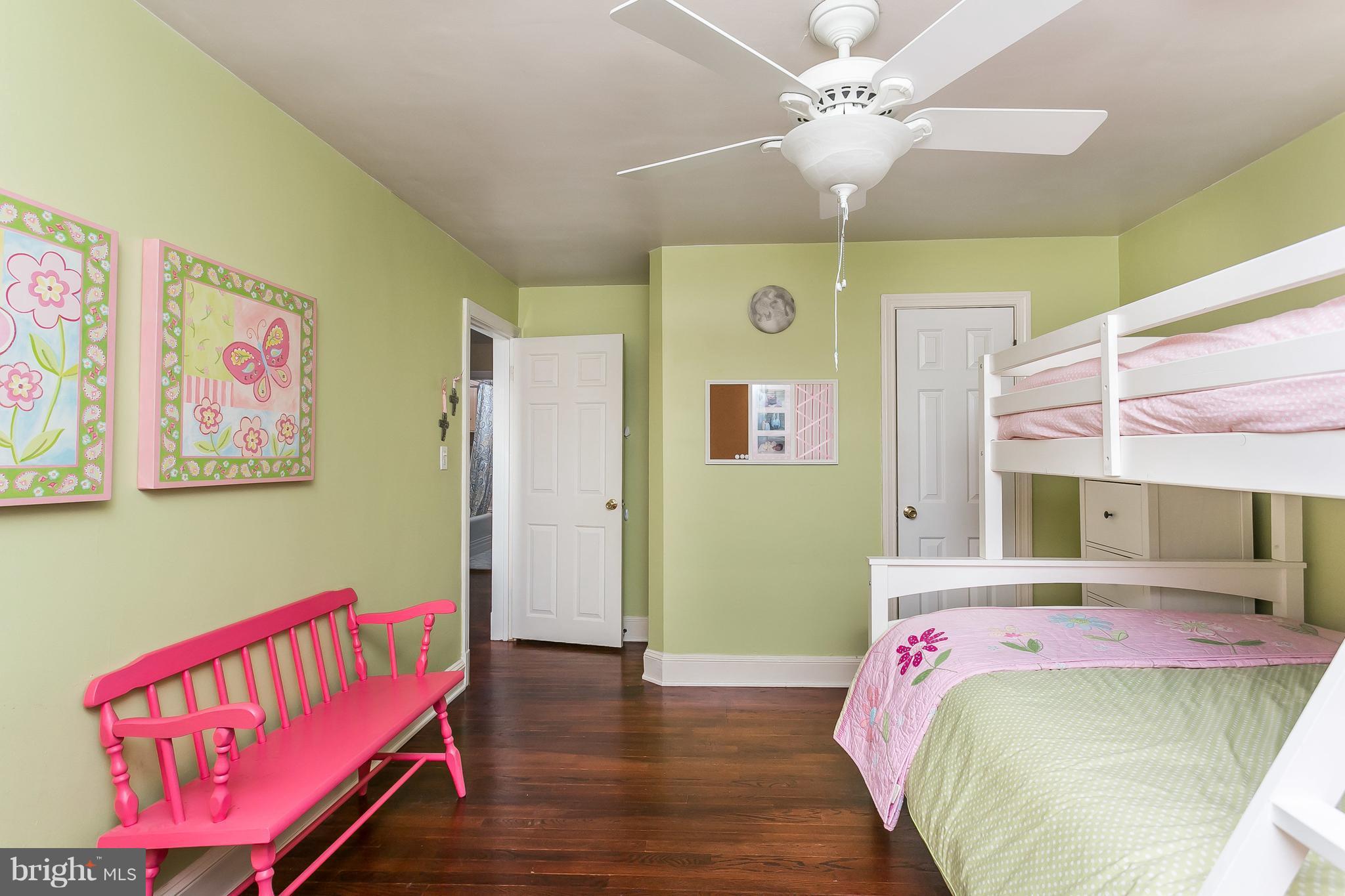 314 Dunkirk Road Baltimore, MD 21212 - Photo 15 of 28 a bedroom with a bed and a chandelier