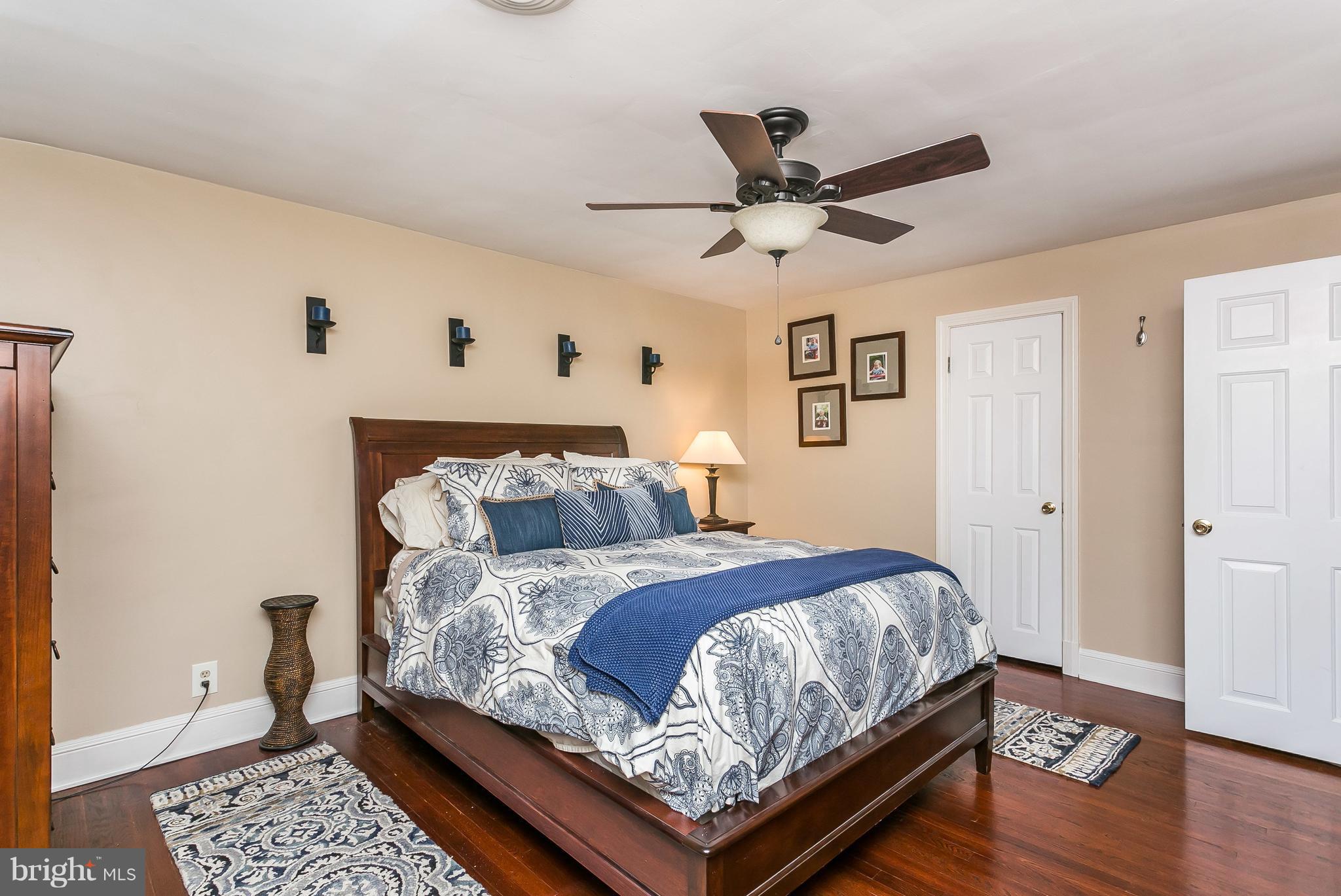 314 Dunkirk Road Baltimore, MD 21212 - Photo 19 of 28 a bedroom with a bed and wooden floor