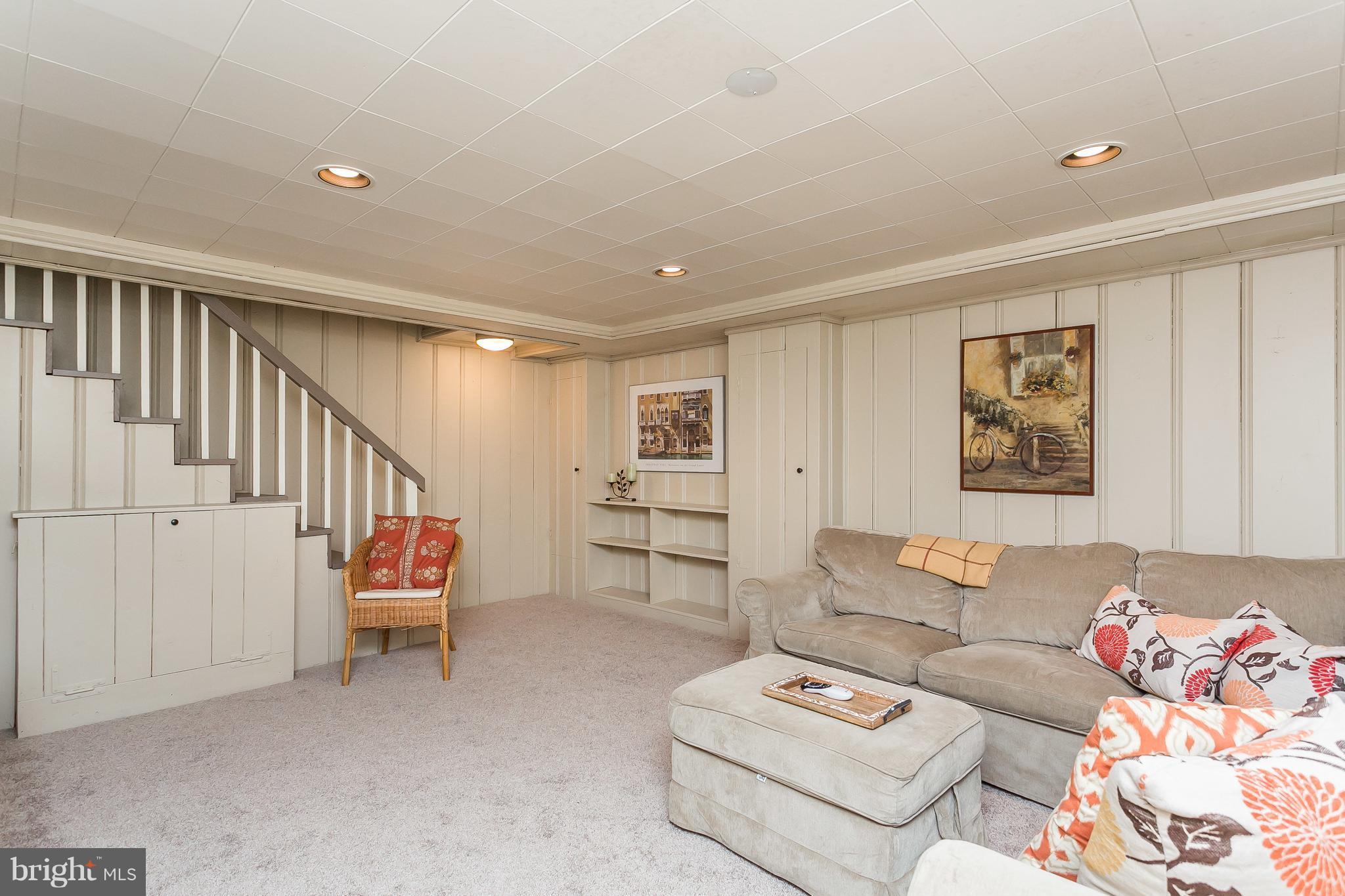 314 Dunkirk Road Baltimore, MD 21212 - Photo 22 of 28 a living room with furniture and wooden floor