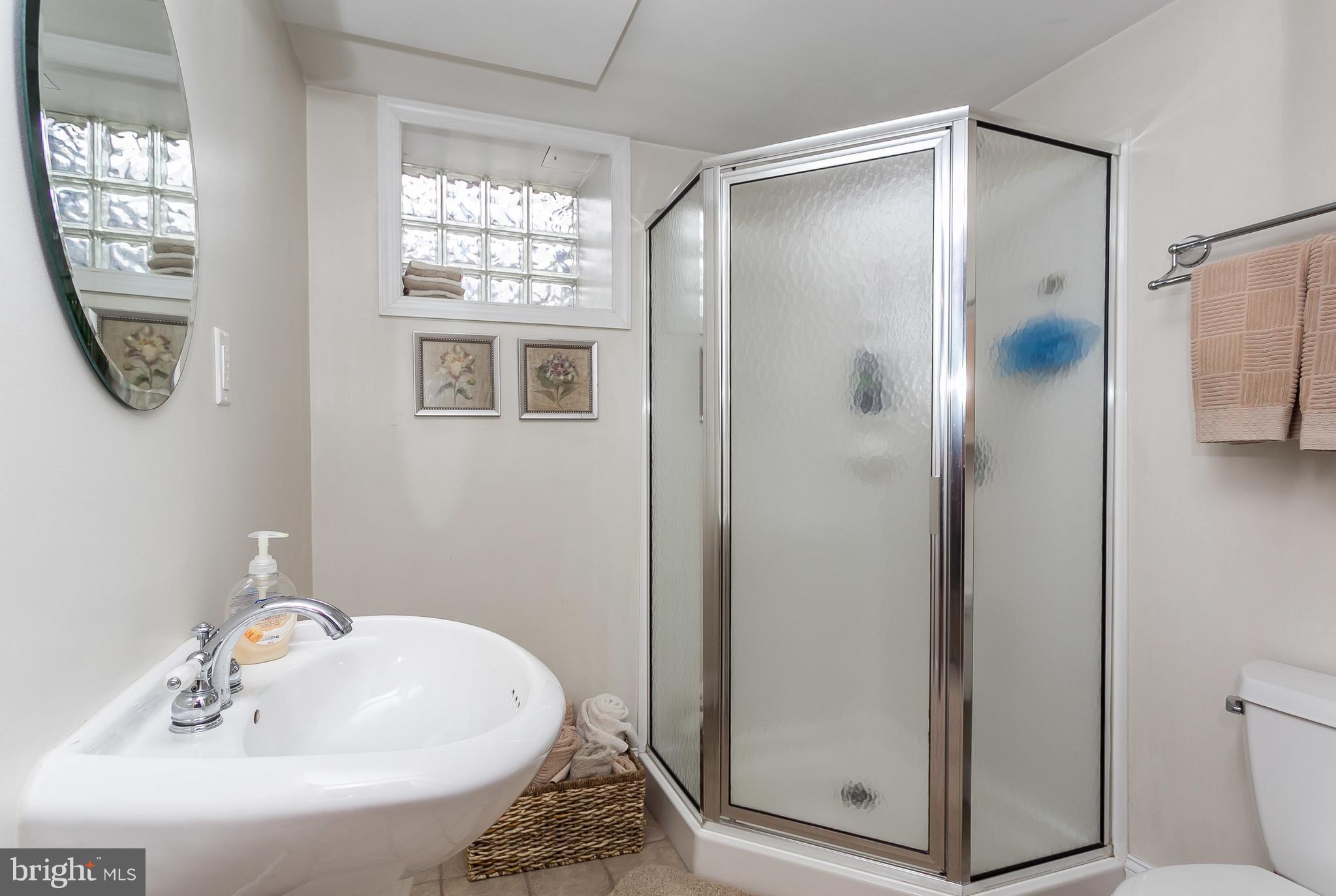 314 Dunkirk Road Baltimore, MD 21212 - Photo 25 of 28 a bathroom with a shower and a sink