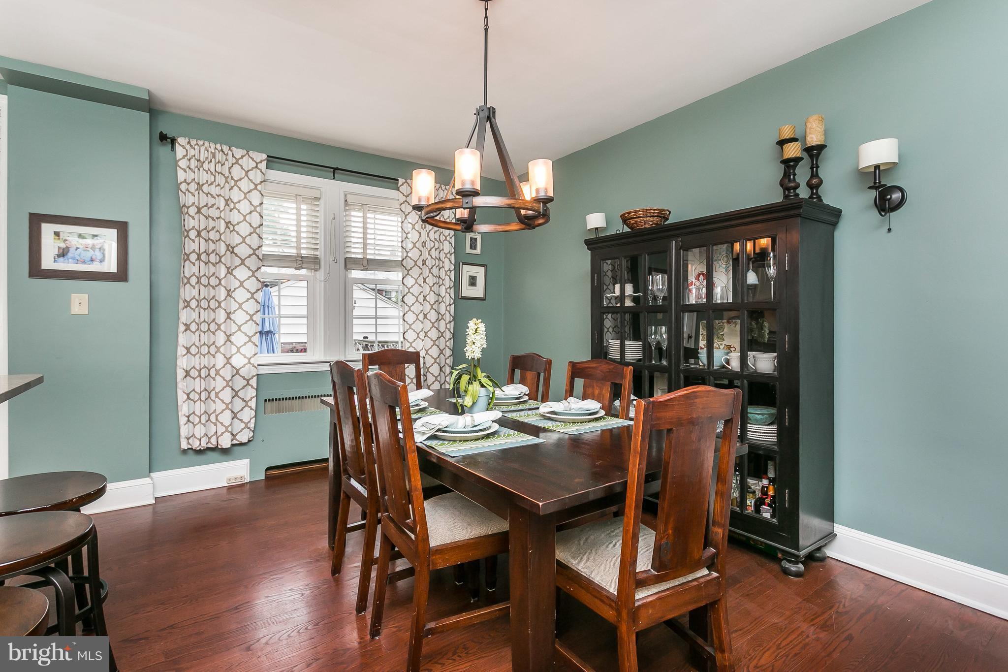 314 Dunkirk Road Baltimore, MD 21212 - Photo 10 of 28 a dining room with furniture a chandelier and wooden floor