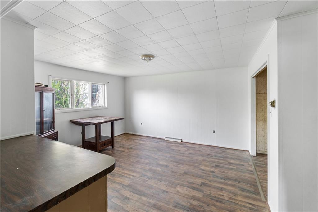 311 East Lutton Street New Castle, PA 16101 - Photo 5 of 10 an empty room with windows and table