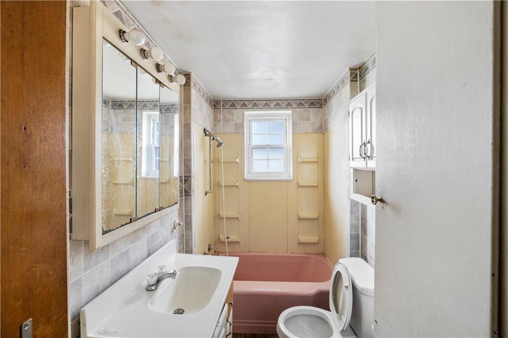 311 East Lutton Street New Castle, PA 16101 - Photo 8 of 10 a bathroom with a sink toilet and shower