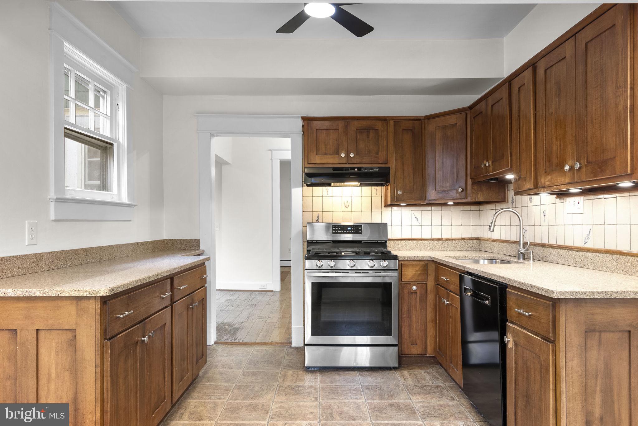 9120 Glenridge Road Silver Spring, MD 20910 - Photo 10 of 59 a kitchen with a stove and a sink