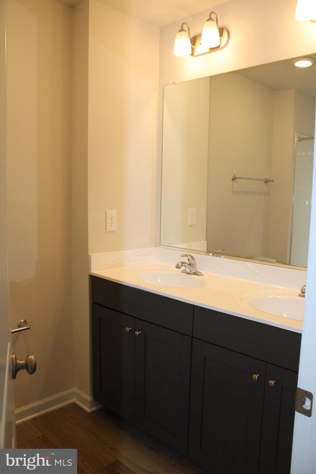 517 Merganser Way Cambridge, MD 21613 - Photo 11 of 13 a bathroom with a sink and a mirror