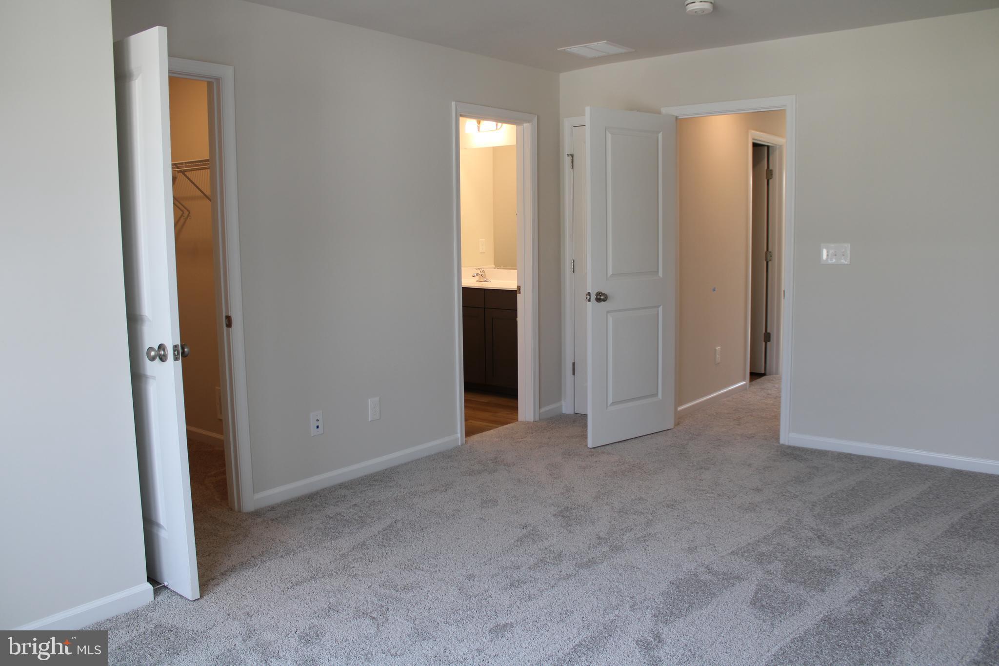 517 Merganser Way Cambridge, MD 21613 - Photo 7 of 13 an empty room with windows and closet