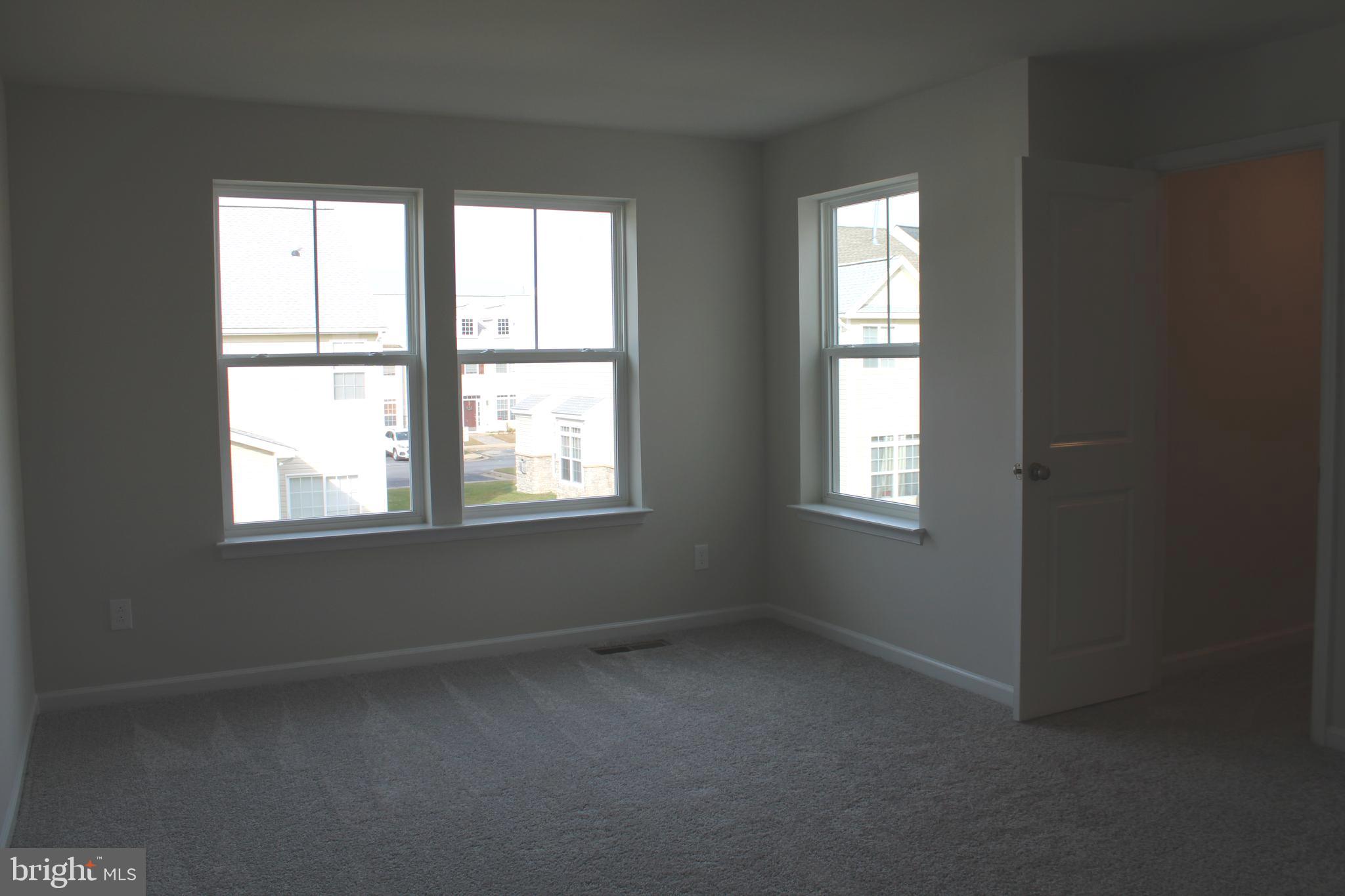 517 Merganser Way Cambridge, MD 21613 - Photo 8 of 13 an empty room with a window