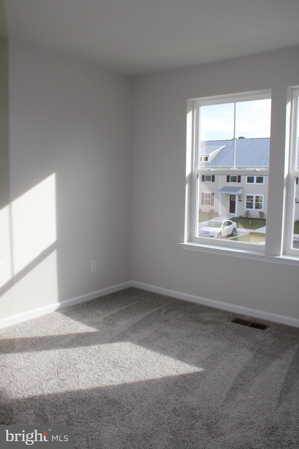 517 Merganser Way Cambridge, MD 21613 - Photo 9 of 13 an empty room with a window